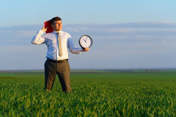 Businessman Holds Office Clock Red Folder Field Green Grass Business — Stock Photo, Image