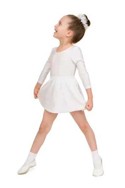 Liten flicka dansa i en vit balklänning — Stockfoto