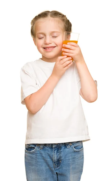 Bambina con un bicchiere di succo — Foto Stock