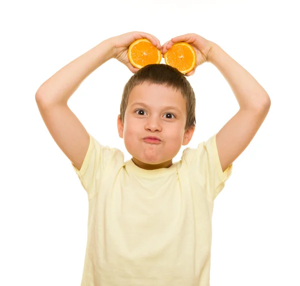 Boy with sliced oranges — Stock Photo, Image