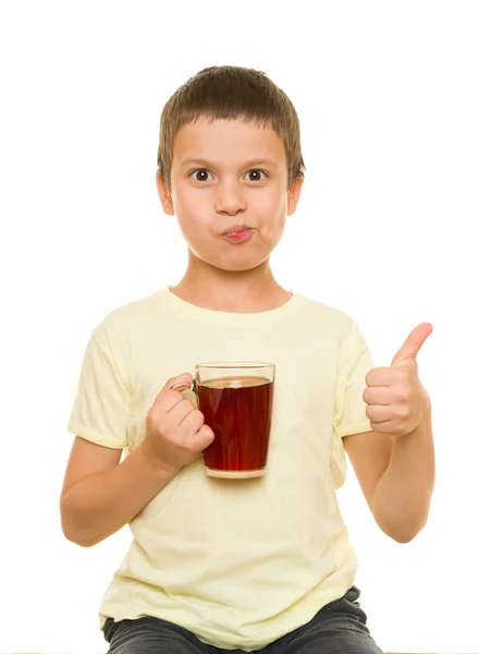 Boy with a glass of juice — Stock Photo, Image