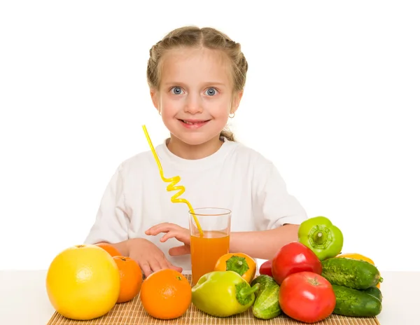 Little girl with fruits and vegetables — Stock Photo, Image