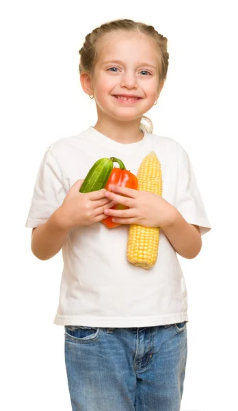 Kleines Mädchen mit Obst und Gemüse auf weißem Grund — Stockfoto