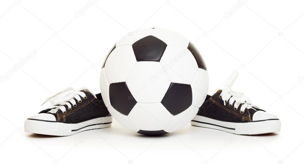 soccer ball and sport shoes on white