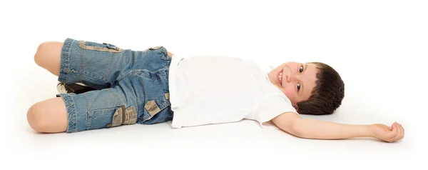 Boy lie on white — Stock Photo, Image