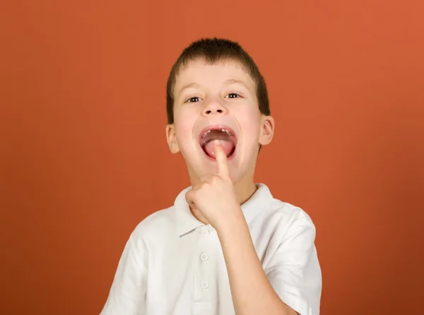 Lost tooth boy portrait on brown — Stock Photo, Image