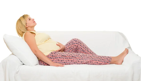 Pregnant woman on sofa — Stock Photo, Image