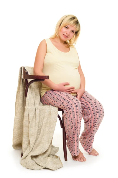 Pregnant woman on chair — Stock Photo, Image