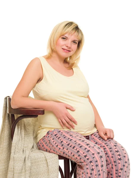 Pregnant woman on chair — Stock Photo, Image