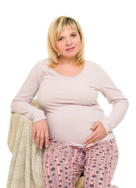 Zwangere vrouw op stoel — Stockfoto