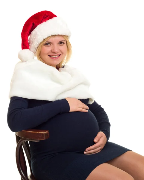 Pregnant woman woman in santa hat on white — Stock Photo, Image