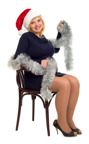 Schwangere Frau mit Weihnachtsmütze auf weißem Hintergrund — Stockfoto