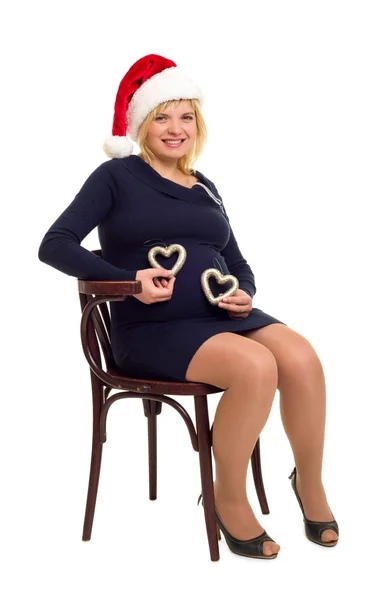 Mujer embarazada feliz con corazones — Foto de Stock