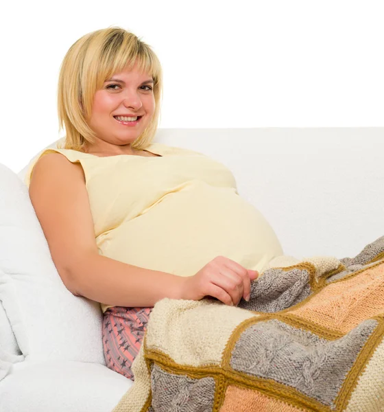 Zwangere vrouw in bed. Rechtenvrije Stockfoto's