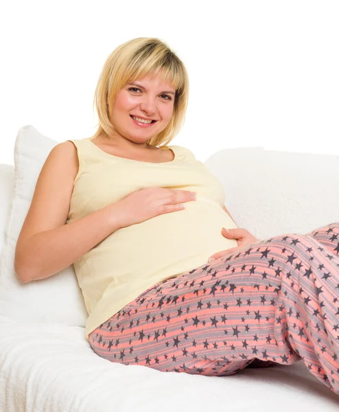 Těhotná žena v posteli. — Stock fotografie