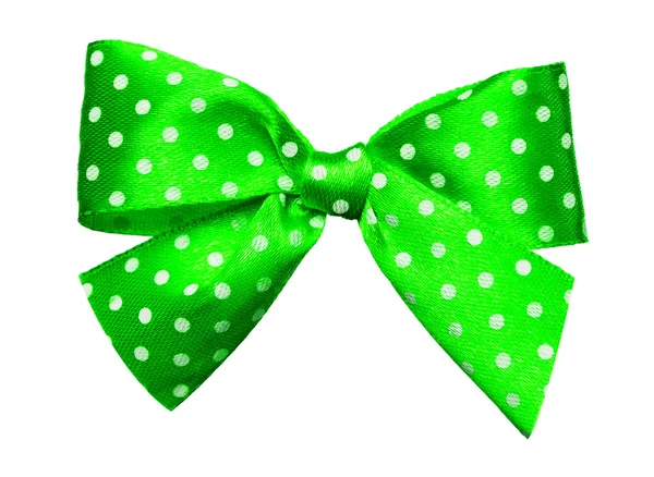 Green bow with white polka dots made from silk — Stock Photo, Image
