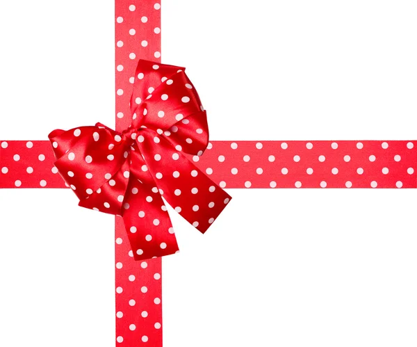 Red bow and ribbon with white polka dots made from silk — Stok fotoğraf