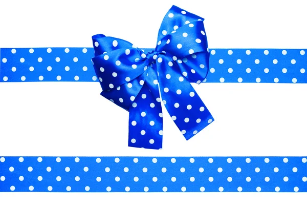 Blue bow and ribbon with white polka dots made from silk — Stock Photo, Image