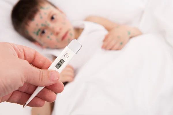 Sick boy in bed — Stock Photo, Image
