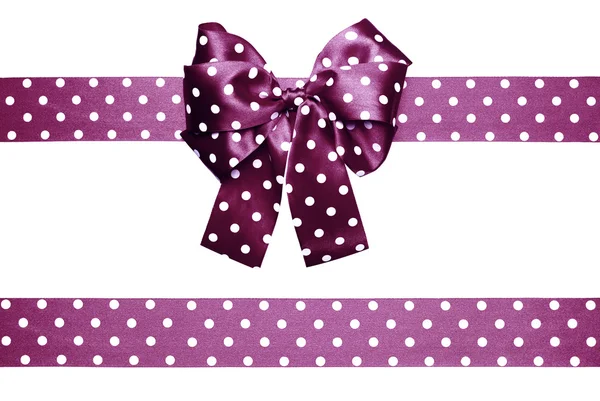 Violet bow and ribbon with white polka dots made from silk — Stock Photo, Image