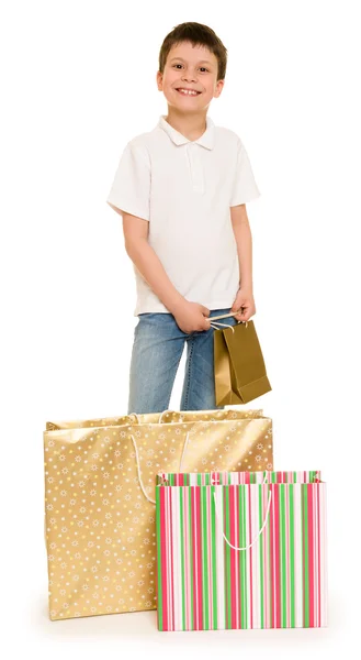 買い物袋を持つ子少年 — ストック写真