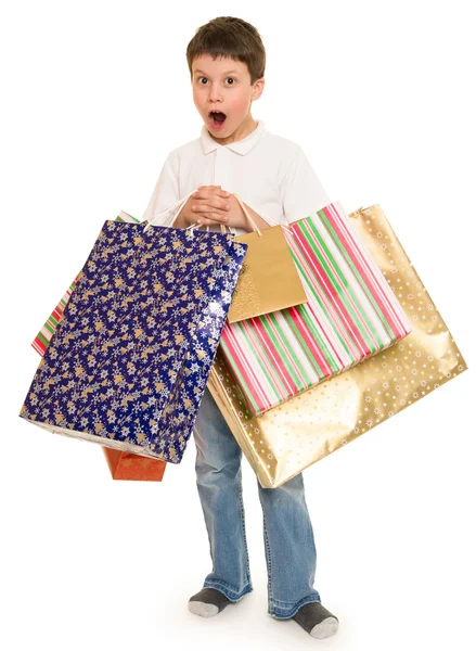 買い物袋を持つ子少年 — ストック写真