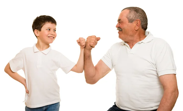 Abuelo y nietos muestran manos musculares —  Fotos de Stock