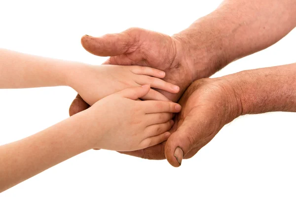 Dítě a stařec ruce — Stock fotografie
