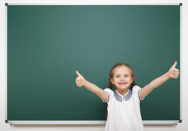 Schoolgirl near school board — Stock Photo, Image