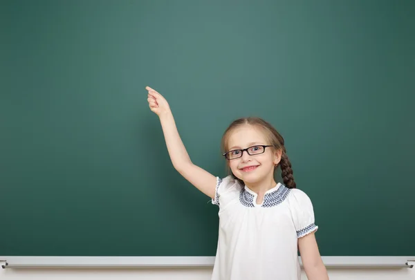 Schoolgirl near school board — Stock Photo, Image