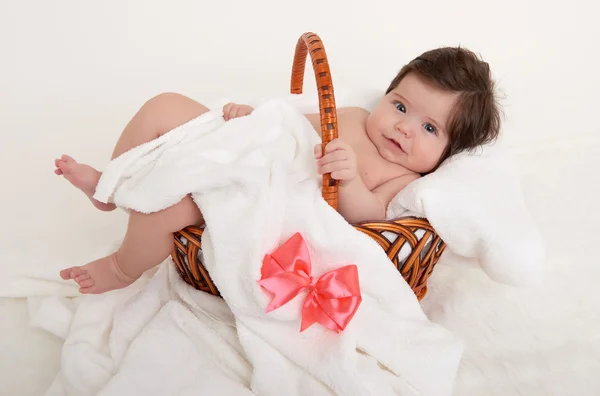 Happy baby in basket on white — Stock Photo, Image