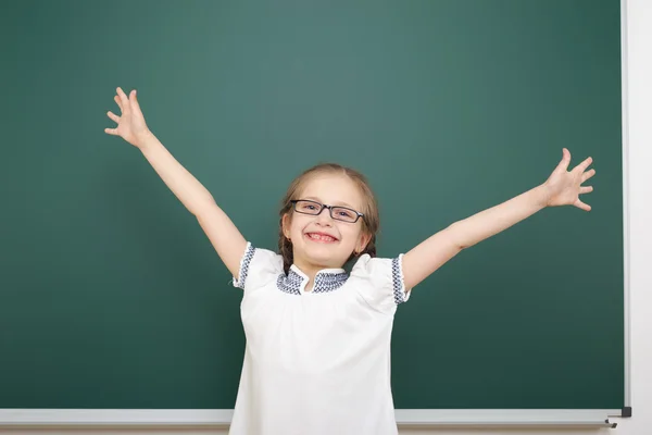 Schoolgirl near school board — Stock Photo, Image