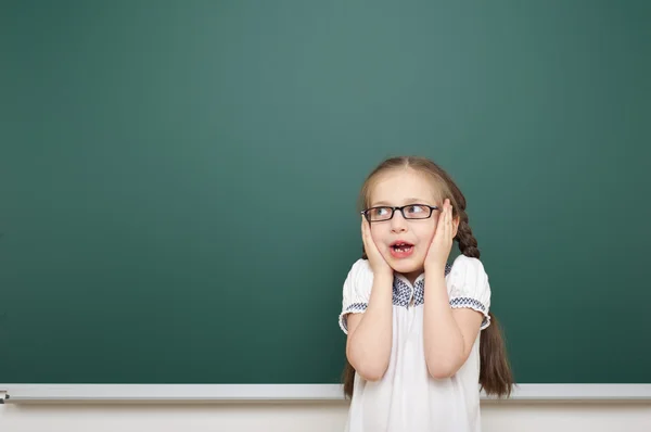 Schoolgirl near school board — Stock Photo, Image