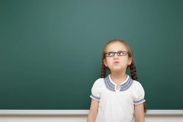 Schoolgirl near school board — Stock Photo, Image