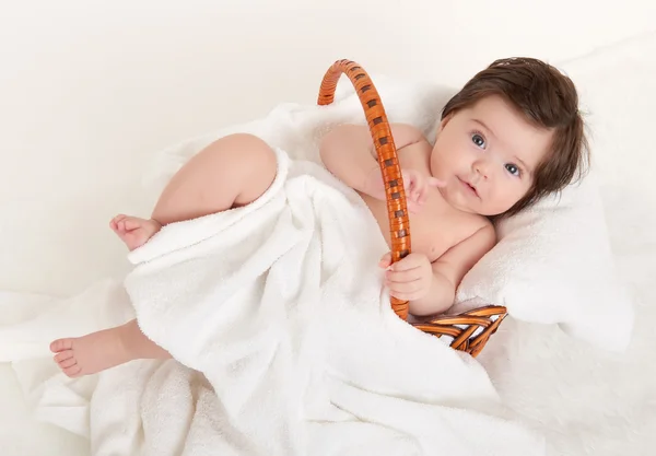 Happy baby in basket on white — Stock Photo, Image