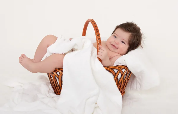 Happy baby in basket on white — Stock Photo, Image