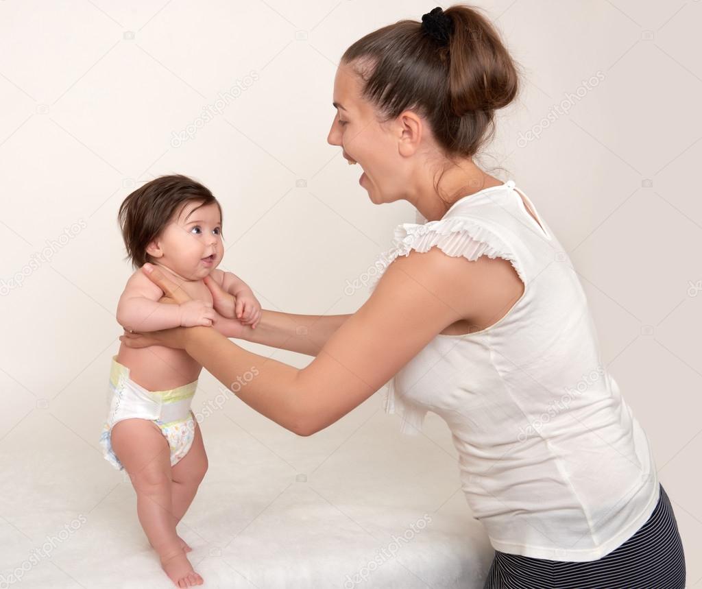 Mother And Baby On White — Stock Photo © Soleg 75928041