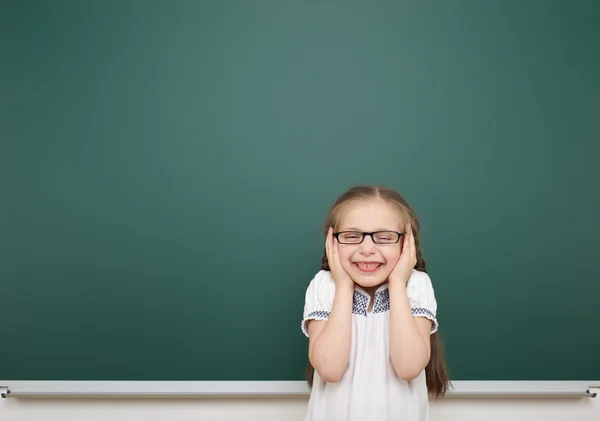 Schoolgirl near school board — Stock Photo, Image