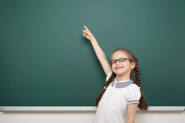 Schoolgirl near school board — Stock Photo, Image