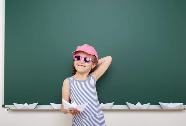 Schoolgirl near school board — Stock Photo, Image