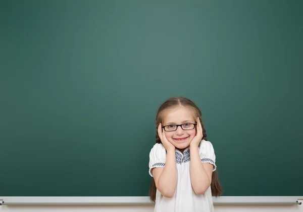 Schoolgirl near school board — Stock Photo, Image