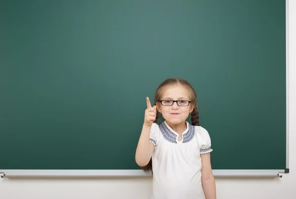 Schoolgirl near school board — Stock Photo, Image