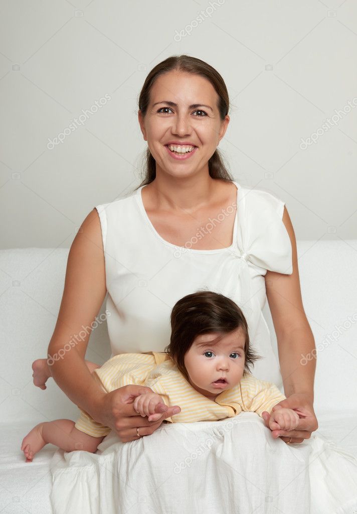 Mother And Baby On White Stock Photo By ©soleg 76561391