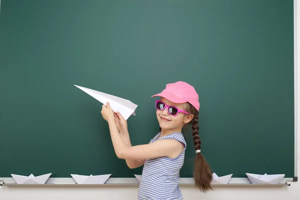 Schoolgirl near school board — Stock Photo, Image