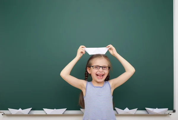 Schoolgirl near school board — Stock Photo, Image