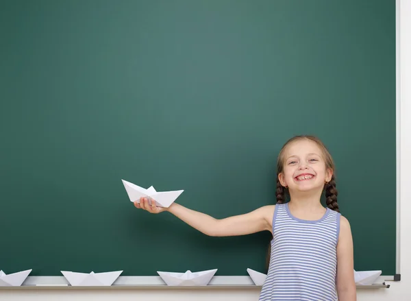 Schoolgirl near school board — Stock Photo, Image