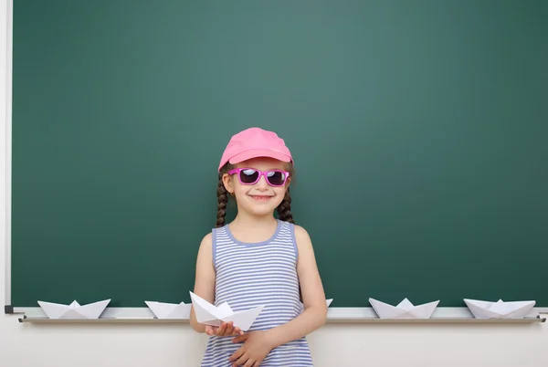 Schoolgirl near school board — Stock Photo, Image