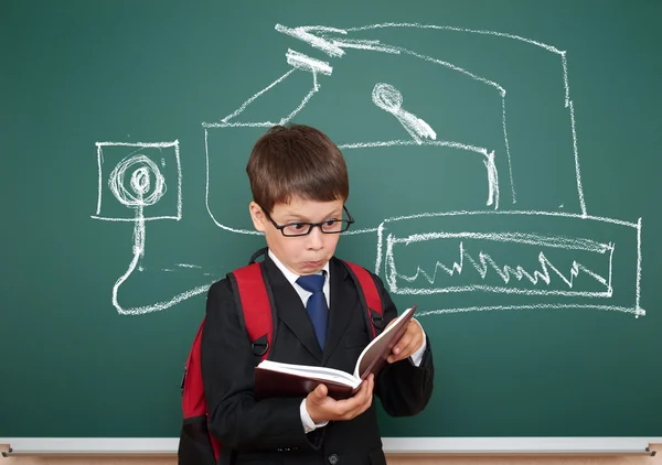 School boy read book about device painted on board Stock Picture