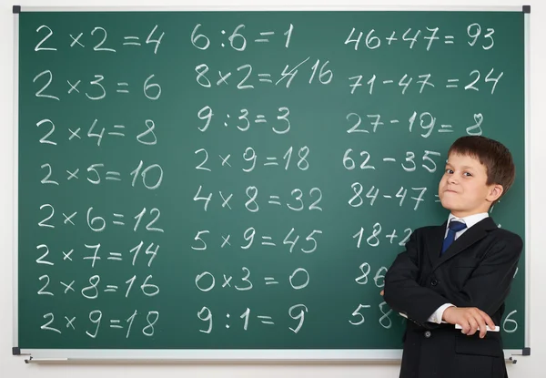 School boy solve math on board — Stock Photo, Image