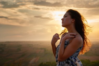 girl portrait at sunset on plain background clipart